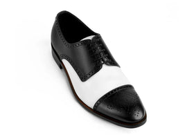 Close-up detail of Bold Brogue shoes highlighting intricate brogue perforation and premium leather craftsmanship