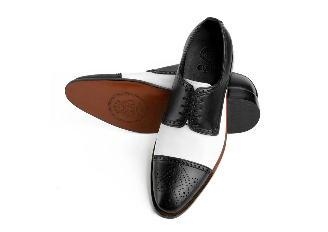 Bottom sole view of Bold Brogue shoes showing durable outsole grip and structured formal construction