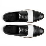 Top view of Bold Brogue shoes showing lace structure, brogue perforation, and black and white contrast leather design