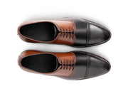 The Kensington Two-Tone men’s cognac and black cap-toe oxford dress shoes top view