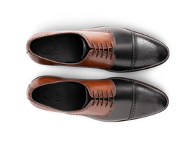 The Kensington Two-Tone men’s cognac and black cap-toe oxford dress shoes top view