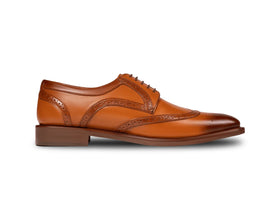 The Shelby Brogue men’s cognac wingtip derby brogue dress shoe side profile