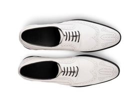 The White Sovereign men’s white wingtip brogue dress shoes top view