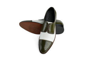 Bottom sole view of Ebony and Ivory brogue shoes showing durable outsole grip and structured construction