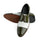 Bottom sole view of Ebony and Ivory brogue shoes showing durable outsole grip and structured construction