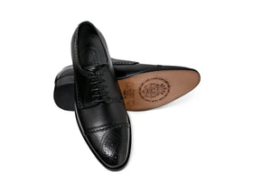 Regal Black oxford shoe outsole sole view with brand logo and leather construction detail